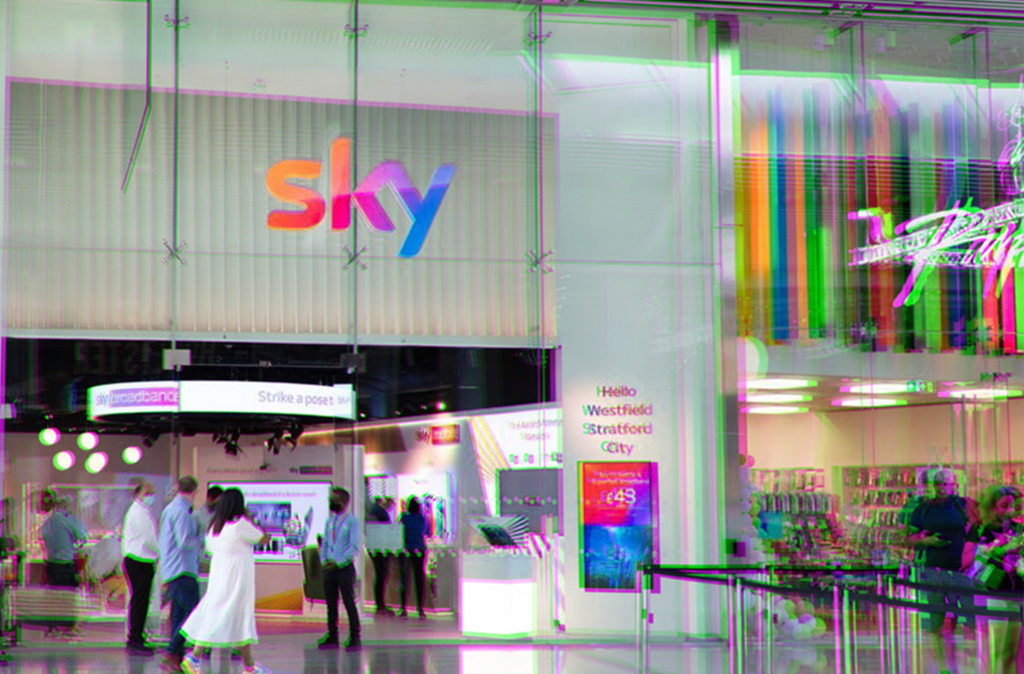 image of a sky store in a busy chopping centre next to a paperchase